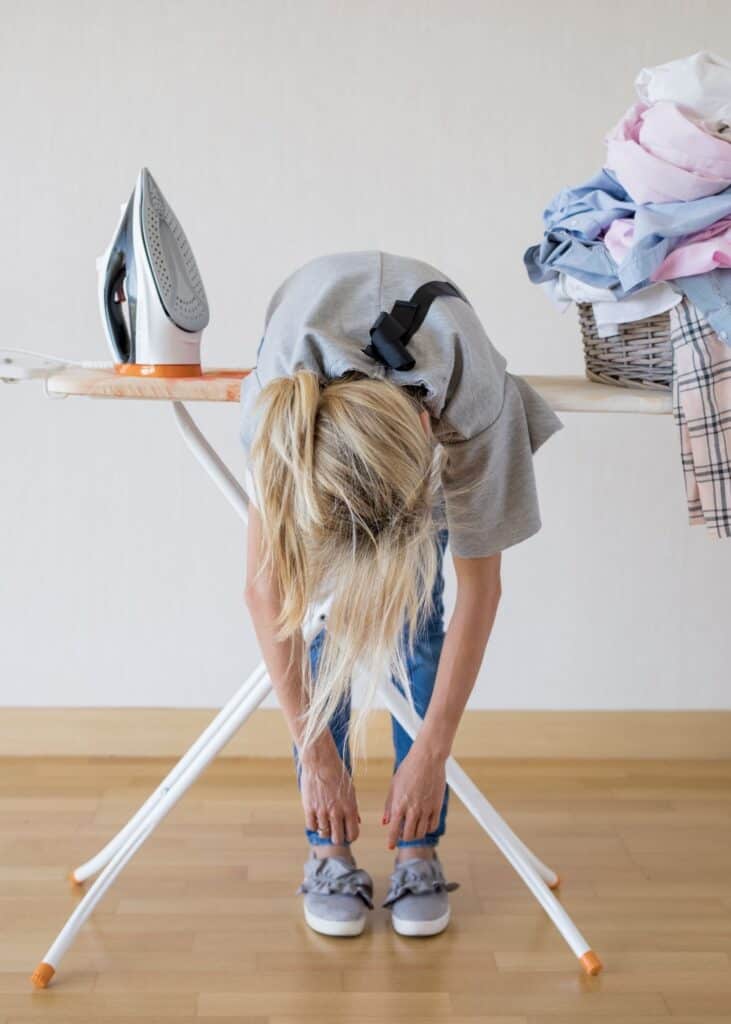 woman doing household chores tired