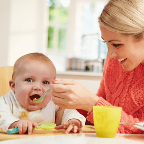 Woman feeding Baby