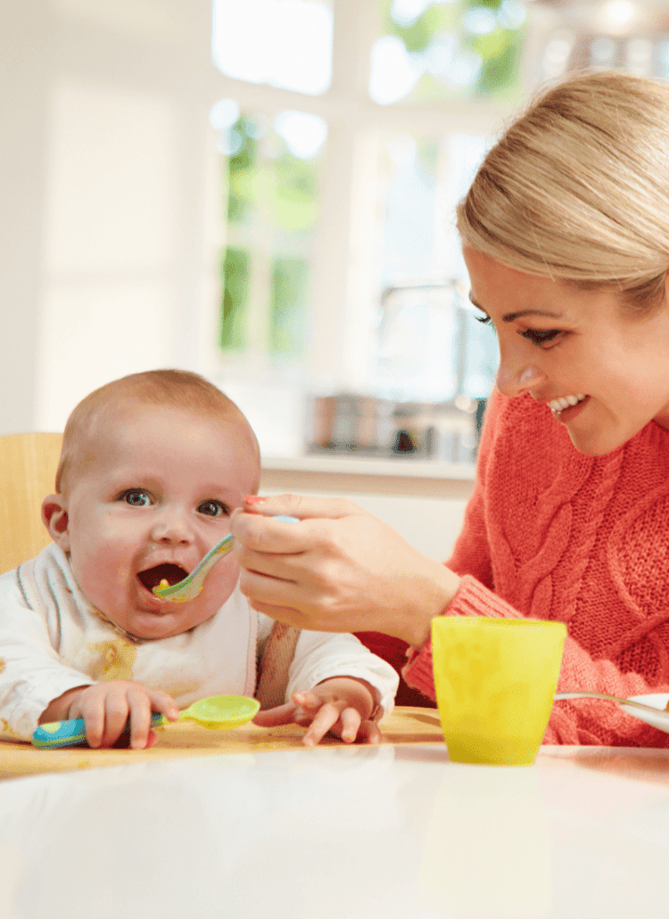 Woman feeding Baby