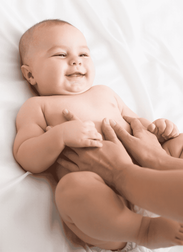 Baby massage smiling