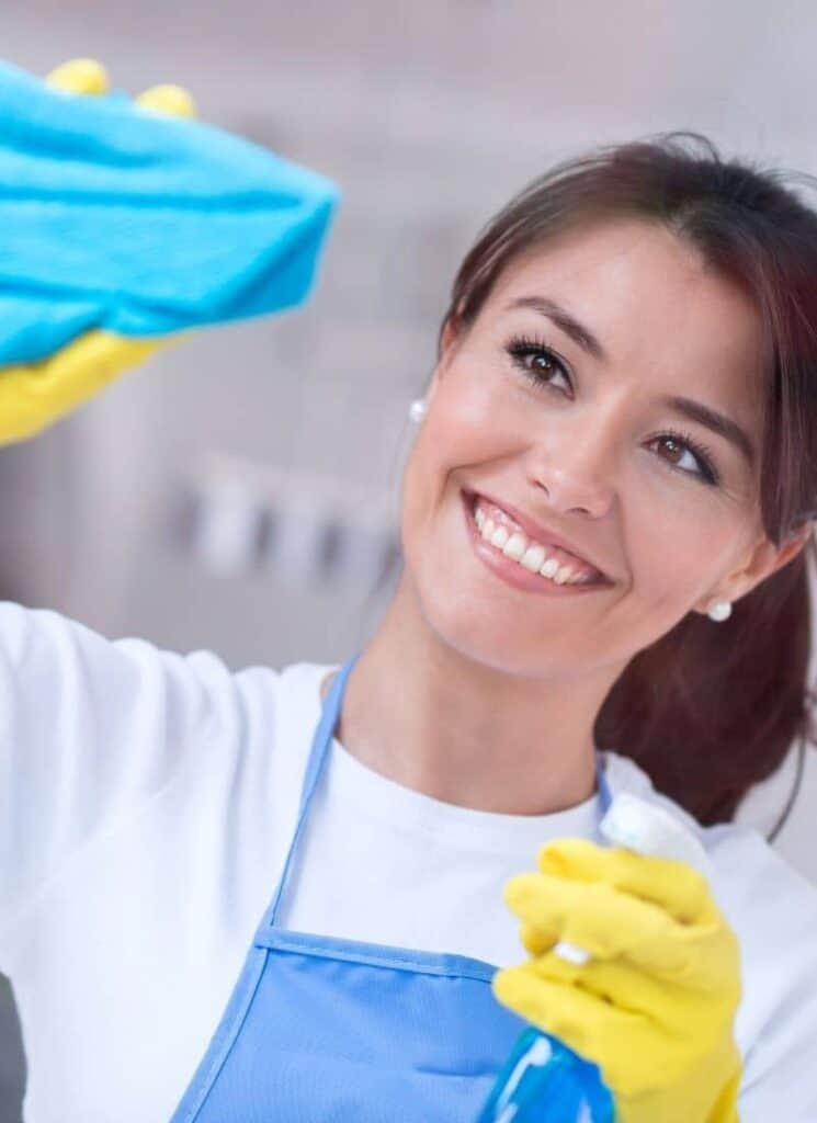 woman cleaning window