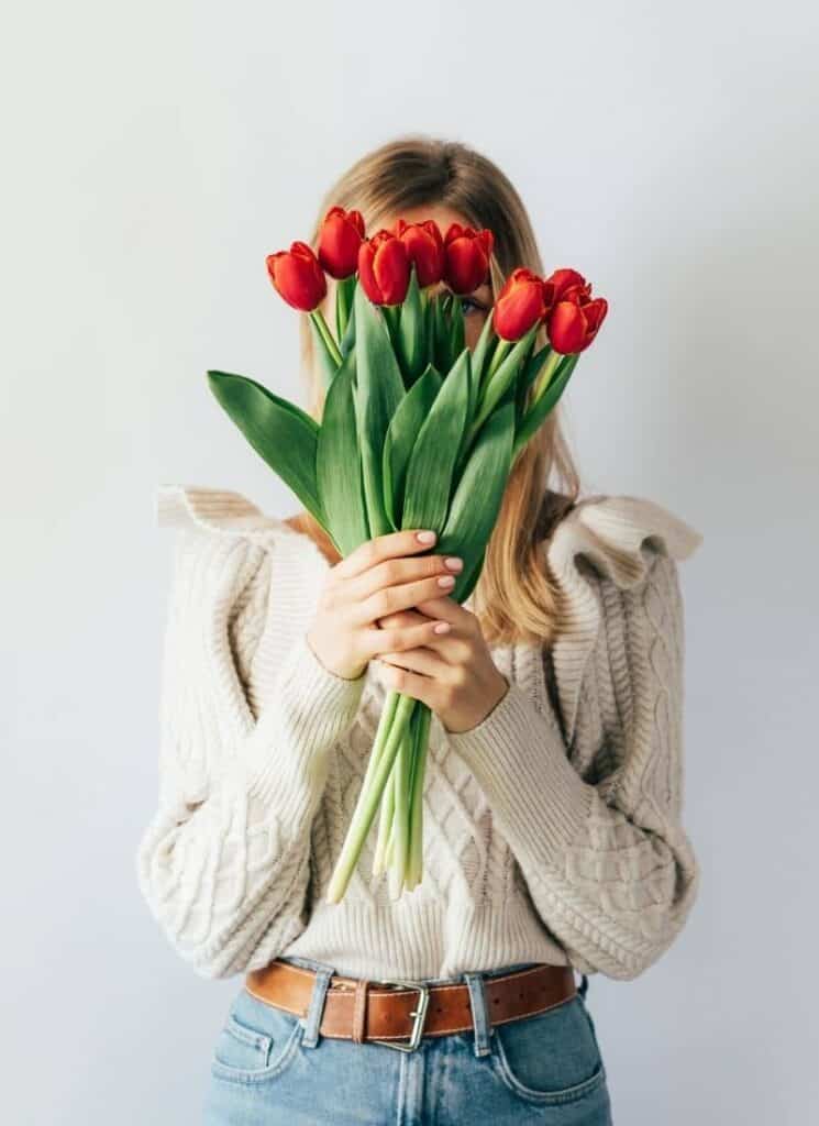 woman holding tulips