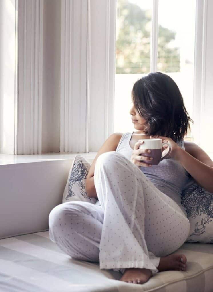 woman looking out of window